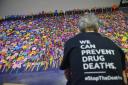 Paper flowers are laid to represents lives lost to drugs at the Scottish Drug Deaths Crisis Conference in Glasgow in 2020