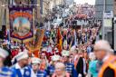 Members of the County Grand Orange Lodge take part in the annual Orange walk parade through the city centre of Glasgow