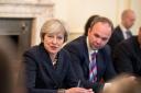 Former prime minister Theresa May with then chief of staff Gavin Barwell (right) hosting a roundtable meeting at 10 Downing Street