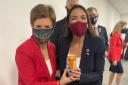 Nicola Sturgeon and Alexandria Ocasio-Cortez hold an Irn-Bru can together after having met at COP26