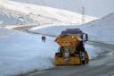 Scottish gritter at work in snowy countryside. Credit: PA