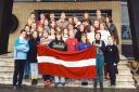 Rev Dr Urzula Glienecke as a student activist with friends and the Latvian flag, which was banned under communism