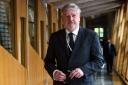 Angus Robertson has criticised childcare provisions in the Scottish Parliament