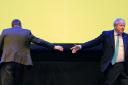 Douglas Ross and Boris Johnson after shaking hands on stage at the Scottish Conservative conference. Photo: PA