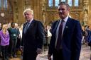 Prime Minister Boris Johnson, left, with Labour leader Keir Starmer, who has called for the cabinet to force the PM to resign