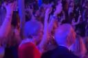 Theresa May filmed dancing at festival hours after PM said he would step down