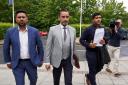 Qasim Sheikh, Aamer Anwar and Majid Haq (left-right) arrive for a press conference at Stirling Court Hotel. Photograph: PA
