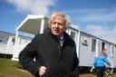 Boris Johnson refused to step down as prime minister after quitting as Tory leader, but has now gone on holiday