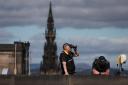 Police officers on the lookout as the Queen's casket was moved through Edinburgh on Monday