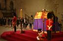 A royal guard collapsed next to the Queen's coffin