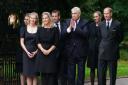 Princess Beatrice of York, Peter Phillips, Zara Tindall, Lady Louise Windsor, Sophie, Countess of Wessex, Prince Andrew, Duke of York and Edward, Earl of Wessex react as they prepare to look at messages and floral tributes left by members of the public