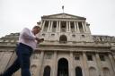 A man walks past the Bank of England in the city of London after sterling hit its lowest level against the dollar since decimalisation in 1971