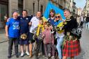Olena Chernysh from Kharkiv with her two children and some visiting Scotland fans