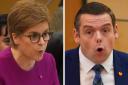 Nicola Sturgeon and Douglas Ross appearing at FMQs, where the two clashed over ferries, again