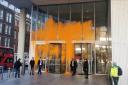 The News Corp building was splattered with orange paint