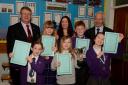 St Palladius primary school pupils that won their Burns competition with past chairman John Hodgart and head teacher Mrs McCallum.