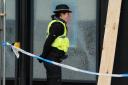 Two men have been arrested after climate activists damaged windows at a Barclays branch in Glasgow