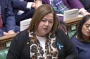 Kirsten Oswald was seen wearing a blue ribbon at PMQs