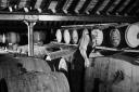 The new whisky joins its forebearers in one of the bonded warehouses where it will stay for the next 8 to 10 years in Dumbarton, United Kingdom, circa 1940