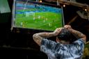 A fan reacts while watching the Fifa World Cup match between Netherlands and the USA