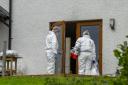 Forensics officers at the scene of an incident involving a firearm at a property in the Teangue area on the Isle of Skye in Scotland