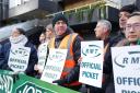 Members of the Rail, Maritime and Transport union (RMT) on the picket line outside Euston station in London