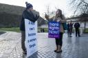 A member of the Scottish Family Party (left) speaks with a supporter of the Gender Recognition Reform Bill (Scotland) during a protest outside the Scottish Parliament