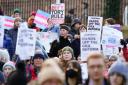 People take part in a demonstration for trans rights outside the UK Government Office at Queen Elizabeth House in Edinburgh.