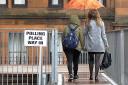 Voters arrive at Notre Dame Primary School set up as a polling station in Glasgow