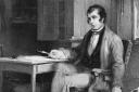 Scots poet Robbie Burns in his cottage composing 'The Cotter's Saturday Night'