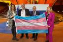 From left to right: Petra Stein, Netherlands MP, Thomas Pringle and Robert Troy, Irish politicians, and Hannah Bardell, SNP MP, holding the trans rights flag at the Council of Europe HQ