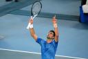 Novak Djokovic celebrates beating Stefanos Tsitsipas to win his 10th Australian Open title and his 22nd Grand Slam