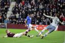 Alfredo Morelos scores the third goal of the game during the cinch Premiership match at Tynecastle