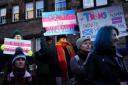People take part in a demonstration for trans rights outside the UK Government Office at Queen Elizabeth House in Edinburgh.