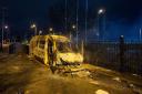 A police van was set alight and fireworks were thrown at officers during a protest outside a hotel housing asylum seekers in Knowsley
