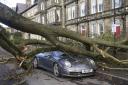 A Porsche 911 car is damaged by a fallen tree in Harrogate, North Yorkshire after Storm Otto