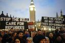 Demonstrators protesting against the Illegal Migration Bill in Parliament Square
