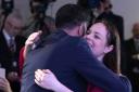 Kate Forbes hugs Humza Yousaf after he was announced the next leader of the SNP