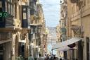 Valletta’s main drag is bustling with bars