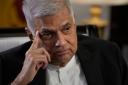 Sri Lanka's new prime minister Ranil Wickremesinghe gestures during an interview with The Associated Press