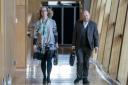 Scottish Green Party co-leaders Lorna Slater and Patrick Harvie head to the main chamber in the Scottish Parliament