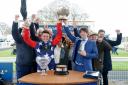 Jockey Jack Tudor (front left) and trainer Christian Williams (front right) along with the owners and sponsors celebrate on the winners podium after Kitty's Light won