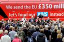 Boris Johnson speaks in front of the controversial 'Brexit bus'