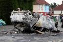 The car that was set alight in Ely, Cardiff, following the riot that broke out after two teenagers died in a crash