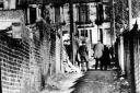 Police and nurses in the 'lane of death', Langside, Glasgow, during the Bible John murders. Photo: 1968