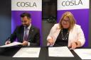 First Minister Humza Yousaf and the Cosla President, Shona Morrison, sign a landmark partnership agreement