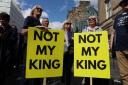 Anti-monarchy protesters outside St Giles' Cathedral in Edinburgh