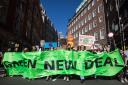 Hundreds of young people join a 2021 march in London during a Global Climate Strike