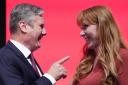 Labour Party leader Sir Keir Starmer congratulates deputy leader Angela Rayner after her speech during the Labour Party Conference