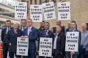 Off-duty police officers from the Scottish Police Federation take part in a demonstration to launch their No Strike - Fair Pay campaign